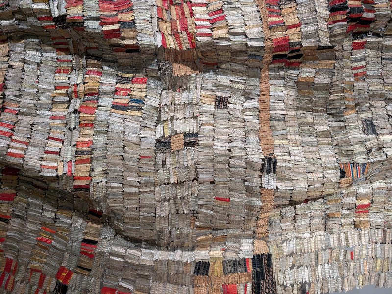 A sort of cloth made of foil from wine bottles