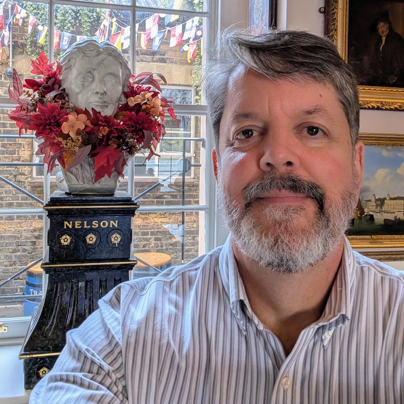 Selfie with a bust of Lord Admiral Nelson with a feather boa. 