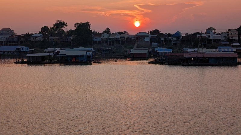 sunset behind floating village